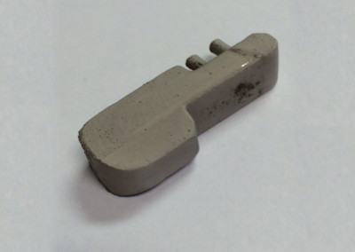 A gray plastic object sitting on top of a table.